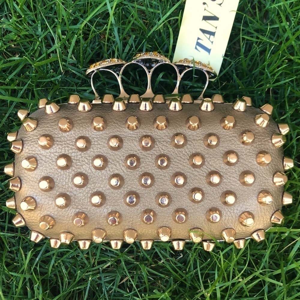 Skulls knuckles ring handles, rhinestone spikes studded clutch.